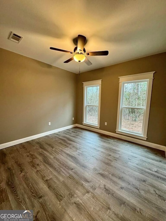 1231 Whipples Crossing Rd, Dudley, GA 31022 - unfurnished room featuring wood finished floors and a ceiling fan