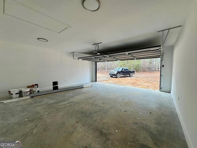 1231 Whipples Crossing Rd, Dudley, GA 31022 - garage with a garage door opener and baseboards