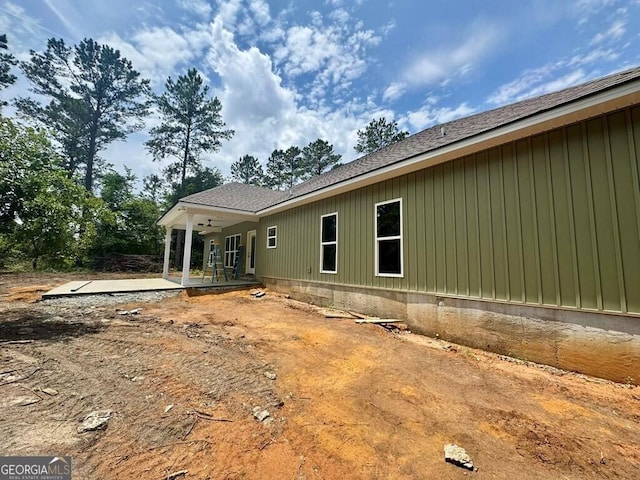 1231 Whipples Crossing Rd, Dudley, GA 31022 - rear view of property featuring a ceiling fan, a patio area, roof with shingles, and board and batten siding