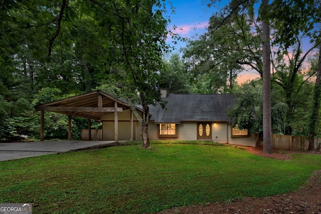 112 Valley Rd, Stockbridge, GA 30281 - view of front facade with driveway, a carport, a chimney, and roof with shingles