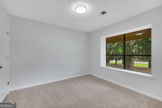 112 Valley Rd, Stockbridge, GA 30281 - empty room with carpet flooring, baseboards, and a textured ceiling