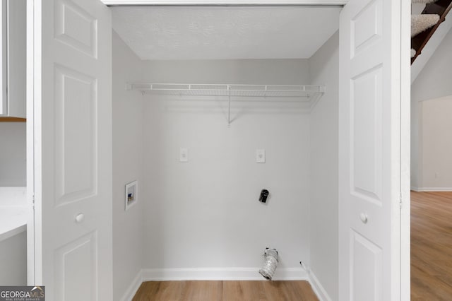 112 Valley Rd, Stockbridge, GA 30281 - laundry room featuring light wood finished floors, washer hookup, and baseboards