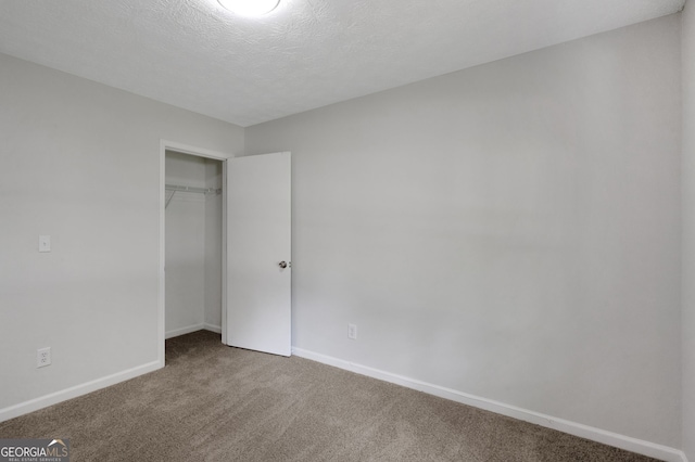 112 Valley Rd, Stockbridge, GA 30281 - unfurnished bedroom featuring carpet flooring, baseboards, and a closet