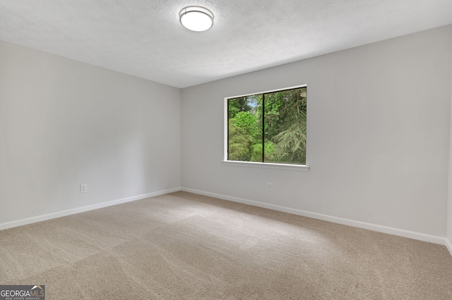 112 Valley Rd, Stockbridge, GA 30281 - carpeted spare room featuring baseboards and a textured ceiling