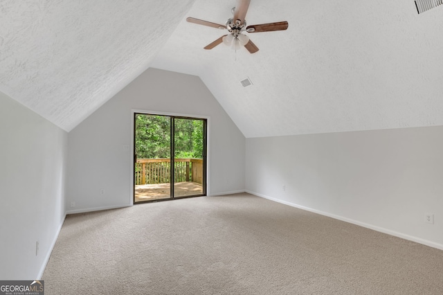 112 Valley Rd, Stockbridge, GA 30281 - additional living space featuring carpet, lofted ceiling, baseboards, a ceiling fan, and a textured ceiling