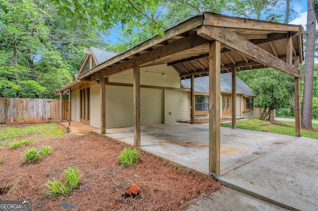112 Valley Rd, Stockbridge, GA 30281 - view of patio featuring driveway and a carport