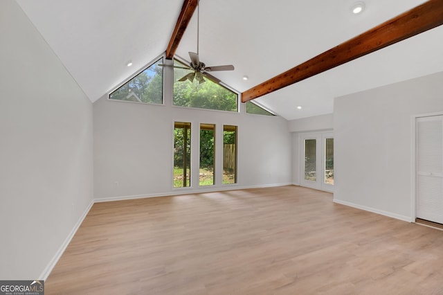 112 Valley Rd, Stockbridge, GA 30281 - unfurnished living room featuring beam ceiling, a ceiling fan, light wood-type flooring, high vaulted ceiling, and baseboards