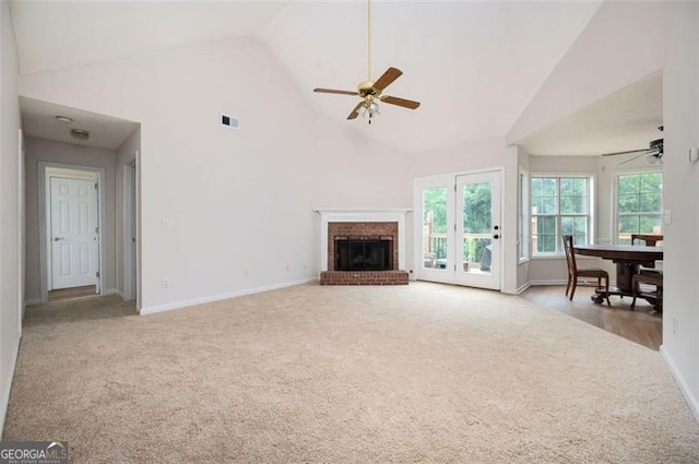 409 Cold Springs Ln, Mcdonough, GA 30252 - unfurnished living room with ceiling fan, carpet floors, high vaulted ceiling, baseboards, and a fireplace