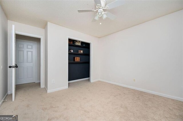 409 Cold Springs Ln, Mcdonough, GA 30252 - unfurnished bedroom featuring carpet flooring, baseboards, and a ceiling fan