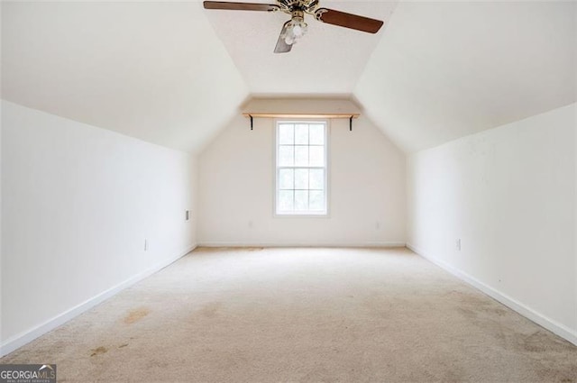 409 Cold Springs Ln, Mcdonough, GA 30252 - additional living space featuring carpet floors, ceiling fan, vaulted ceiling, and baseboards