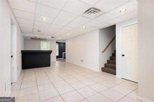 409 Cold Springs Ln, Mcdonough, GA 30252 - unfurnished living room featuring stairway, baseboards, a drop ceiling, light tile patterned floors, and recessed lighting