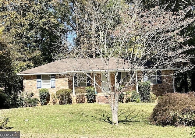984 Morrow Rd, Morrow, GA 30260 - ranch-style house with brick siding and a front yard