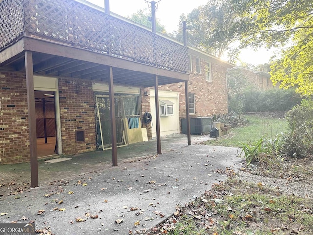 984 Morrow Rd, Morrow, GA 30260 - rear view of property featuring brick siding and a patio area
