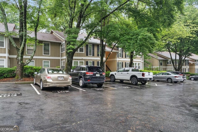 5157 Roswell Rd Unit 1, Atlanta, GA 30342 - uncovered parking lot with a residential view