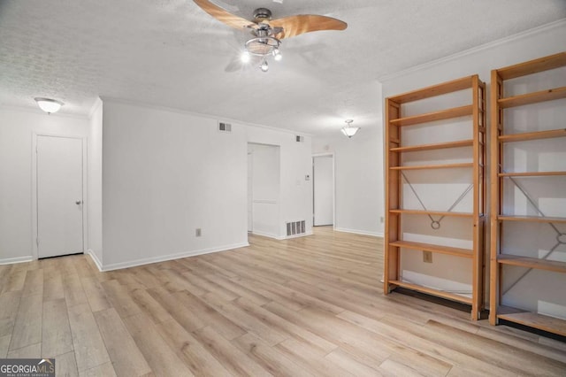 5157 Roswell Rd Unit 1, Atlanta, GA 30342 - spare room with a textured ceiling, a ceiling fan, crown molding, light wood-style floors, and baseboards