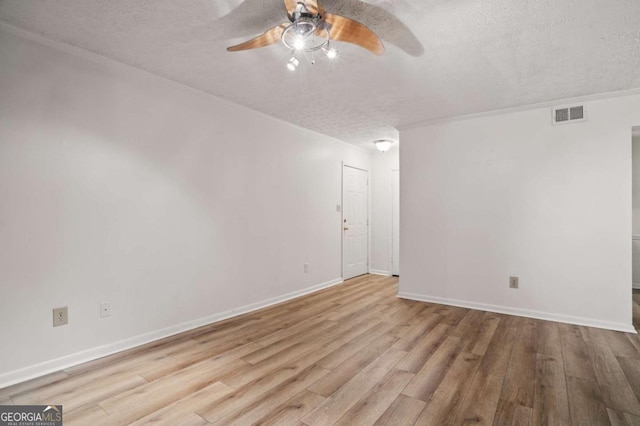 5157 Roswell Rd Unit 1, Atlanta, GA 30342 - spare room with a textured ceiling, a ceiling fan, wood finished floors, and baseboards
