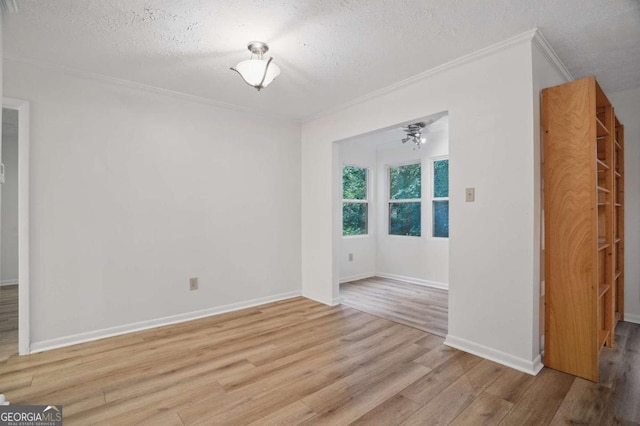 5157 Roswell Rd Unit 1, Atlanta, GA 30342 - unfurnished room featuring wood finished floors, a textured ceiling, crown molding, and baseboards