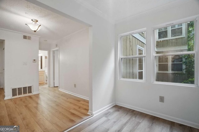 5157 Roswell Rd Unit 1, Atlanta, GA 30342 - unfurnished room with ornamental molding, light wood-type flooring, and baseboards