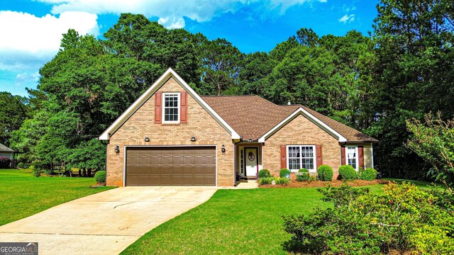 6830 Peeksville Rd, Mcdonough, GA 30252 - traditional home with brick siding, concrete driveway, and a front lawn