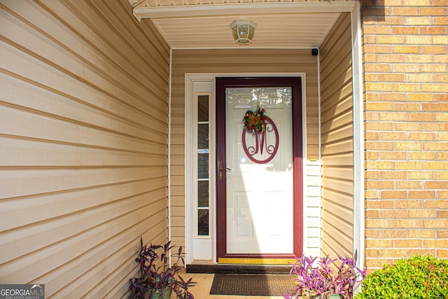 6830 Peeksville Rd, Mcdonough, GA 30252 - view of exterior entry featuring brick siding