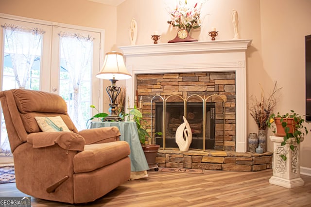 6830 Peeksville Rd, Mcdonough, GA 30252 - sitting room with a fireplace, wood finished floors, plenty of natural light, and baseboards