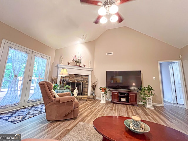 6830 Peeksville Rd, Mcdonough, GA 30252 - living area with light wood-style floors, vaulted ceiling, a ceiling fan, french doors, and baseboards