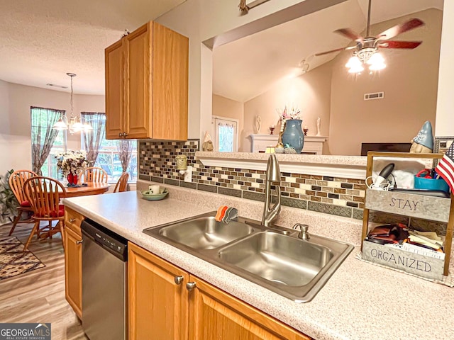 6830 Peeksville Rd, Mcdonough, GA 30252 - kitchen with stainless steel dishwasher, a sink, light wood-style flooring, light countertops, and decorative backsplash