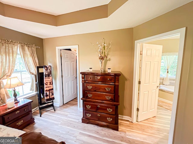 6830 Peeksville Rd, Mcdonough, GA 30252 - bedroom featuring multiple windows, light wood-type flooring, and baseboards