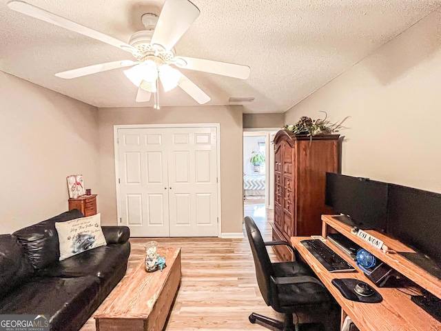 6830 Peeksville Rd, Mcdonough, GA 30252 - office area featuring a textured ceiling, light wood-style floors, and ceiling fan