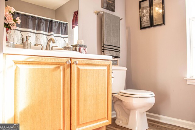 6830 Peeksville Rd, Mcdonough, GA 30252 - full bathroom with toilet, wood finished floors, baseboards, vanity, and curtained shower