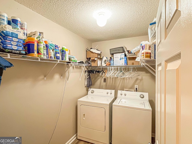 6830 Peeksville Rd, Mcdonough, GA 30252 - laundry area featuring separate washer and dryer and a textured ceiling