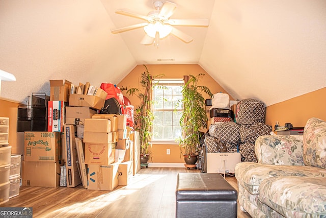 6830 Peeksville Rd, Mcdonough, GA 30252 - living room featuring wood finished floors, a ceiling fan, lofted ceiling, and baseboards