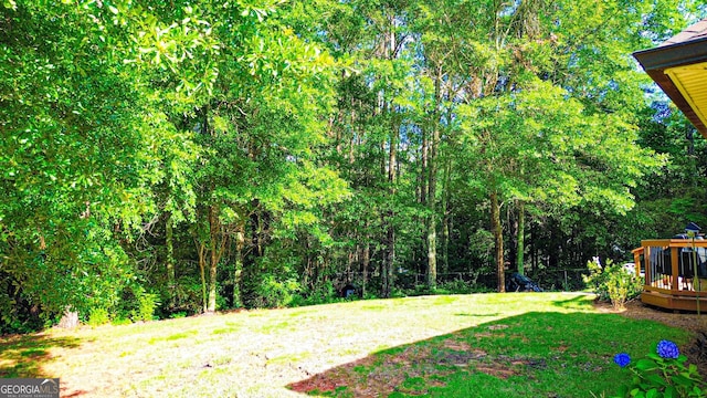 6830 Peeksville Rd, Mcdonough, GA 30252 - view of grassy yard with a wooden deck