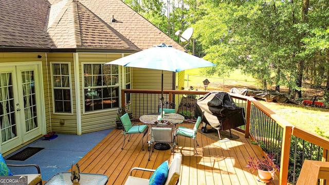 6830 Peeksville Rd, Mcdonough, GA 30252 - wooden deck with french doors and outdoor dining space