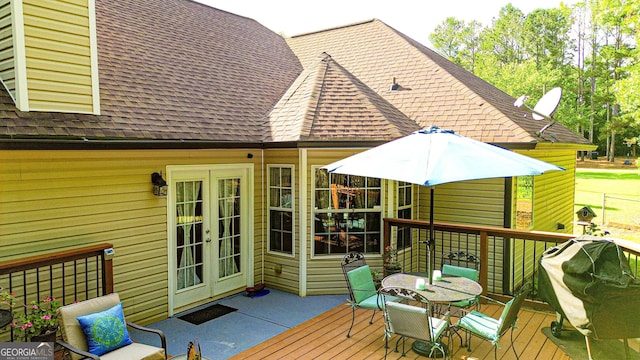 6830 Peeksville Rd, Mcdonough, GA 30252 - wooden deck with french doors and outdoor dining area