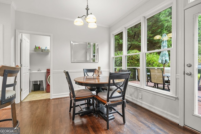 702 Crescent Cir, Canton, GA 30115 - dining area with crown molding, dark wood-style floors, a chandelier, and baseboards