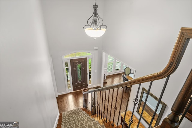 702 Crescent Cir, Canton, GA 30115 - foyer entrance featuring a towering ceiling, wood finished floors, baseboards, and stairway