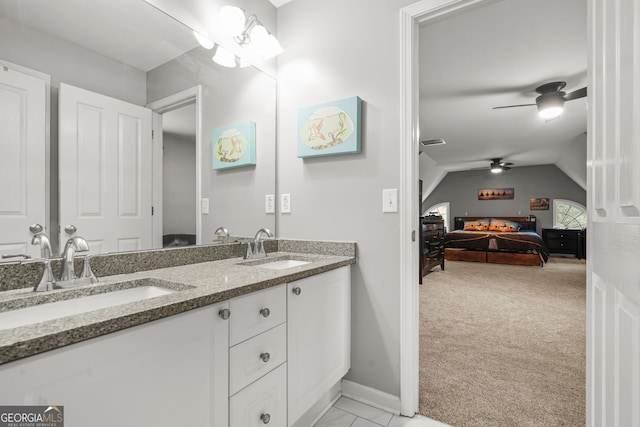 702 Crescent Cir, Canton, GA 30115 - ensuite bathroom with double vanity, a ceiling fan, baseboards, and vaulted ceiling