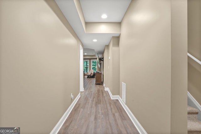 702 Crescent Cir, Canton, GA 30115 - hall featuring wood finished floors, baseboards, recessed lighting, and stairway