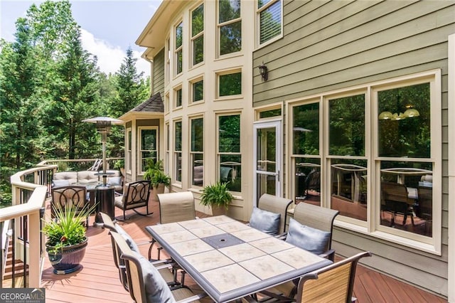 702 Crescent Cir, Canton, GA 30115 - wooden terrace with outdoor dining area and outdoor lounge area