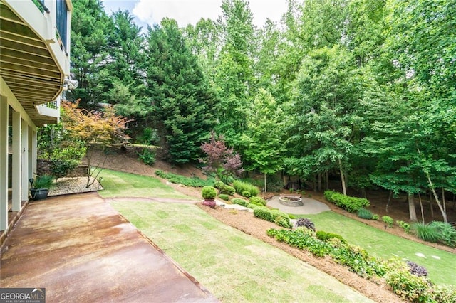 702 Crescent Cir, Canton, GA 30115 - view of grassy yard featuring an outdoor fire pit and a patio