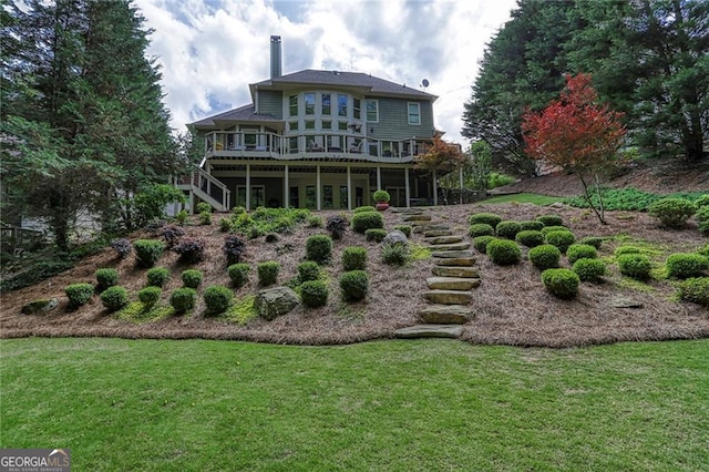702 Crescent Cir, Canton, GA 30115 - back of property with stairway, a deck, a lawn, and a chimney