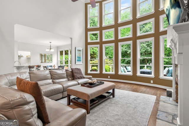 702 Crescent Cir, Canton, GA 30115 - living area featuring a towering ceiling, wood finished floors, and a ceiling fan