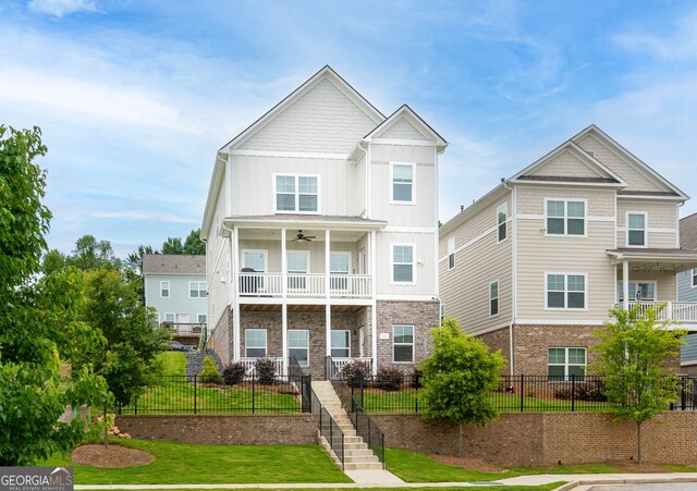 831 Corsiglia Farm Flts, Marietta, GA 30060 - multi unit property with board and batten siding, ceiling fan, a balcony, stairway, and brick siding