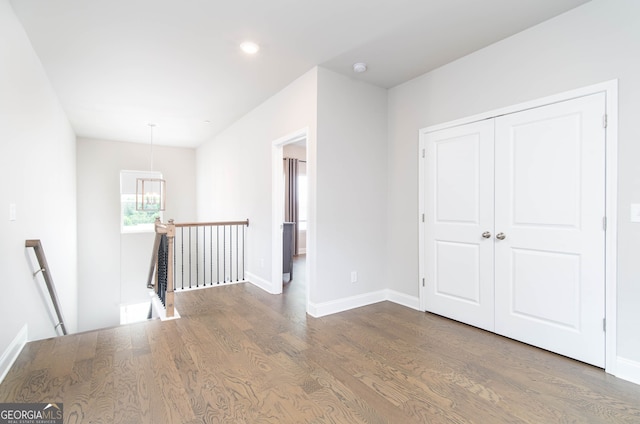 831 Corsiglia Farm Flts, Marietta, GA 30060 - hall with an upstairs landing, wood finished floors, baseboards, recessed lighting, and a chandelier