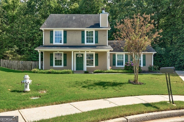 1600 Coal Shovel Trl NE, Conyers, GA 30013 - view of front facade featuring a chimney, stucco siding, and a porch