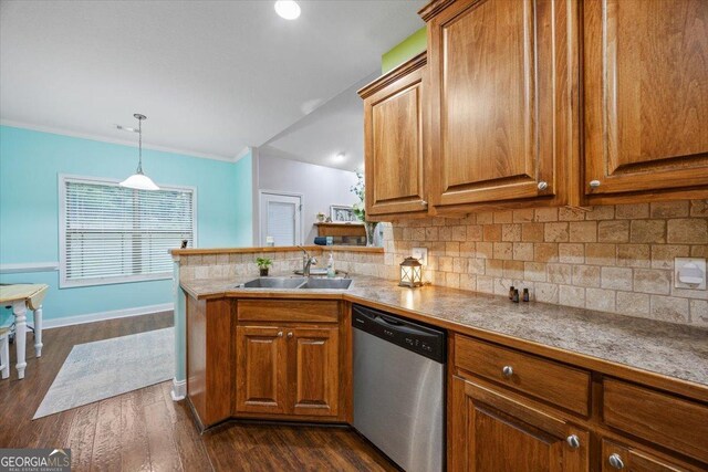 161 Presidents Way, Forsyth, GA 31029 - kitchen with stainless steel dishwasher, brown cabinetry, decorative backsplash, and ornamental molding