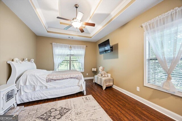 161 Presidents Way, Forsyth, GA 31029 - bedroom featuring a raised ceiling, dark wood-style floors, crown molding, and ceiling fan
