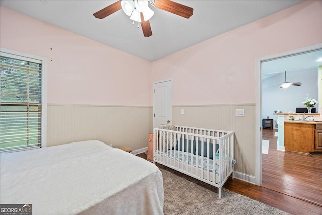 161 Presidents Way, Forsyth, GA 31029 - bedroom featuring wainscoting, multiple windows, wood finished floors, and a ceiling fan