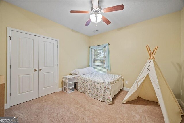 161 Presidents Way, Forsyth, GA 31029 - carpeted bedroom with a closet and a ceiling fan